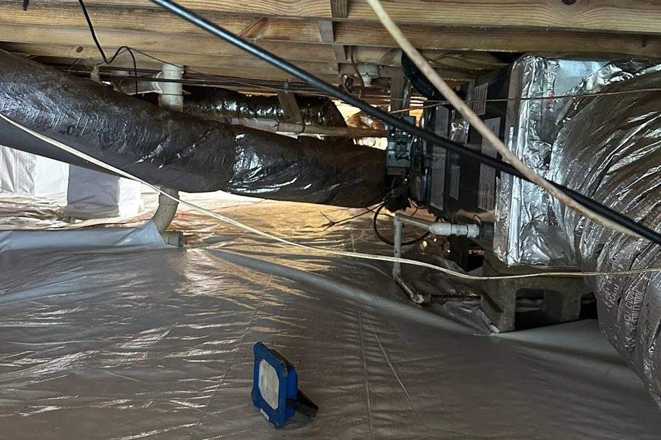Full crawlspace lined with a clean vapor barrier
