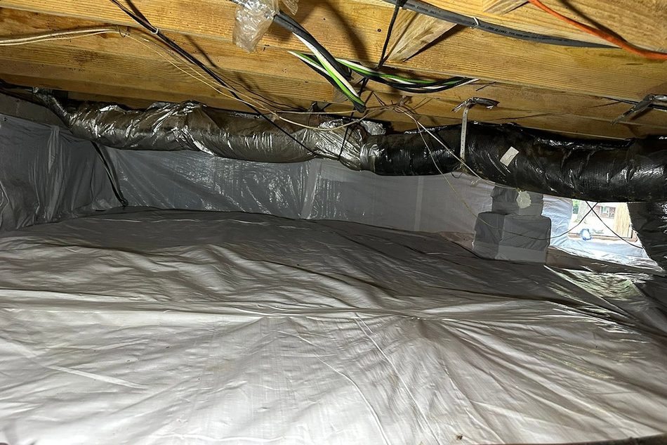 Crawlspace ductwork and ground sealed against moisture